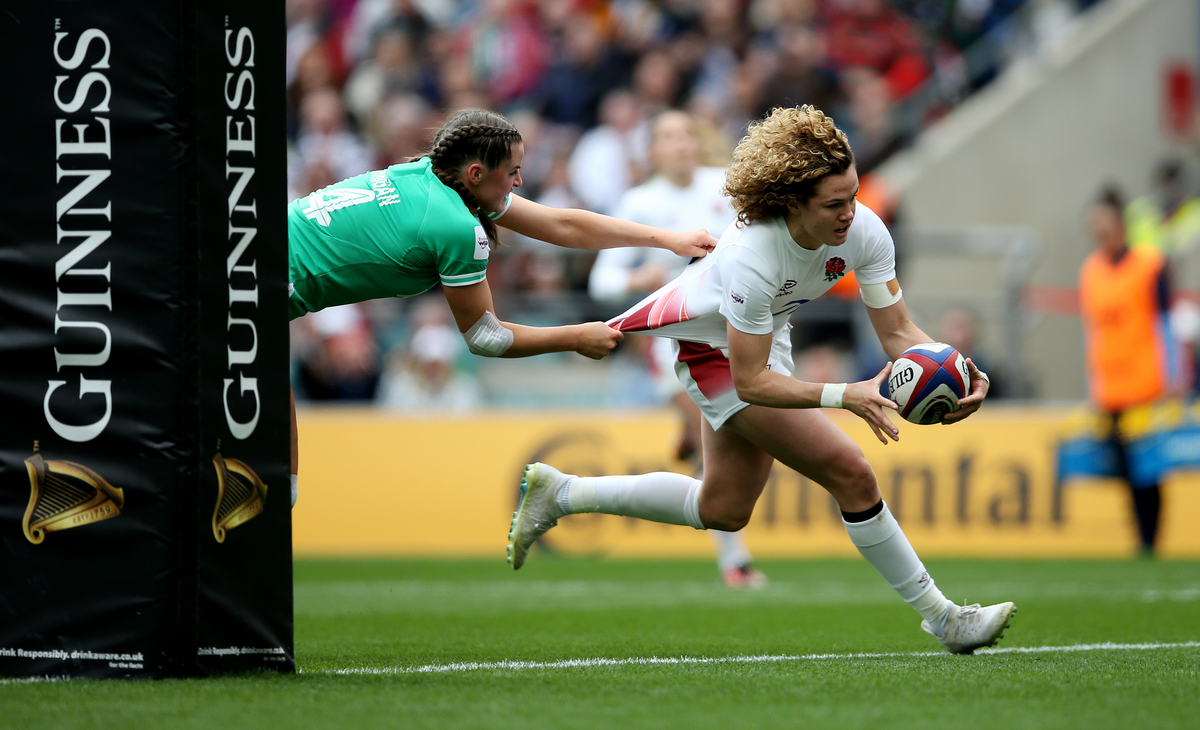 	LONDON, ENGLAND - APRIL 20: Ellie Kildunne of England scores her team's fifth try whilst under pressure from Katie Corrigan of Ireland during the Guinness Women's Six Nations 2024 match between England and Ireland at Twickenham Stadium on April 20, 2024 in London, England. (Photo by Steve Bardens - RFU/The RFU Collection via Getty Images)