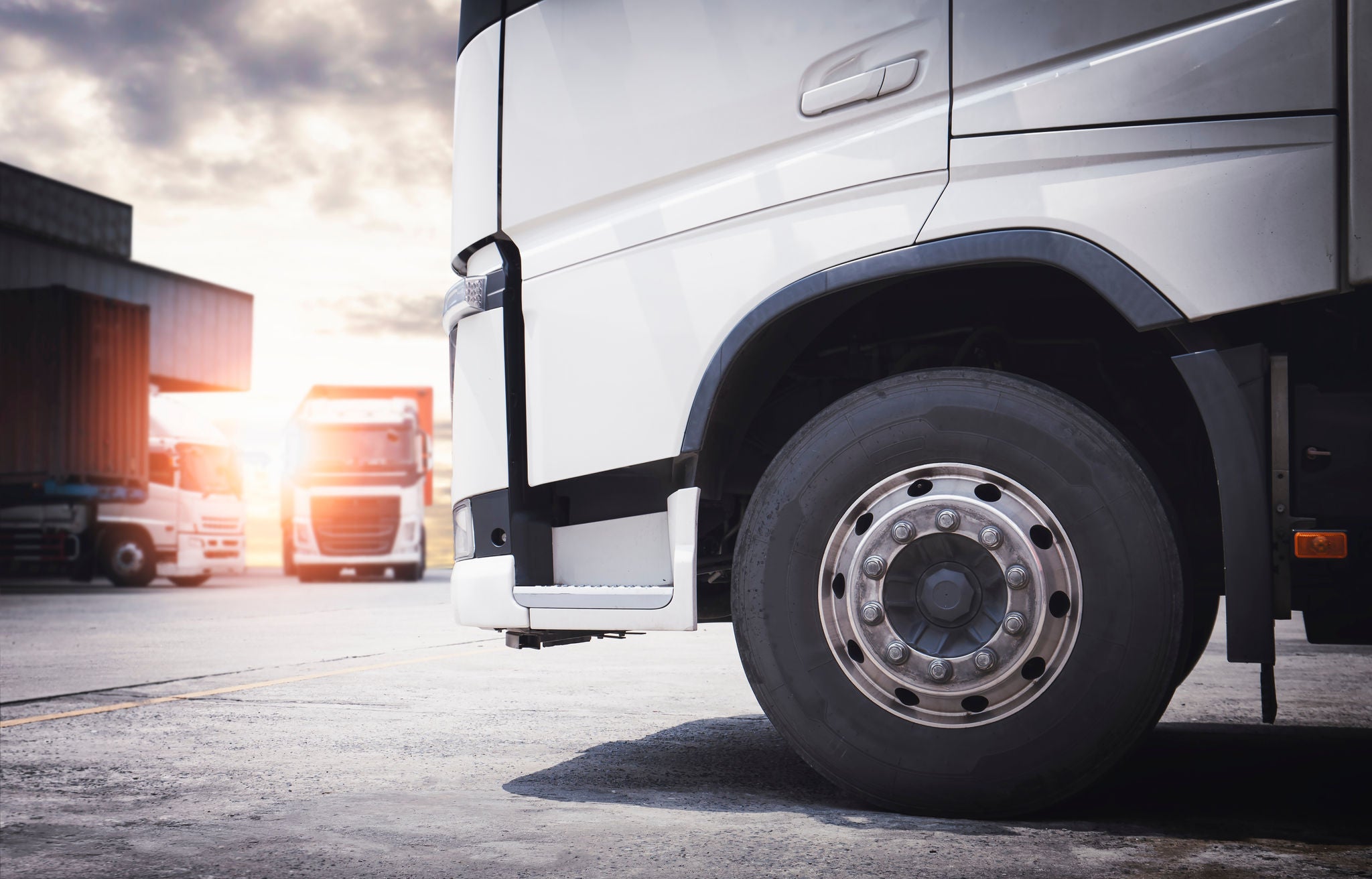 Front of Semi Truck a Parking at the Warehouse. A Big Truck Wheels Tires. Cargo Freight Truck Transportation Logistics.	; Shutterstock ID 2063848811; purchase_order: -; job: -; client: -; other: -